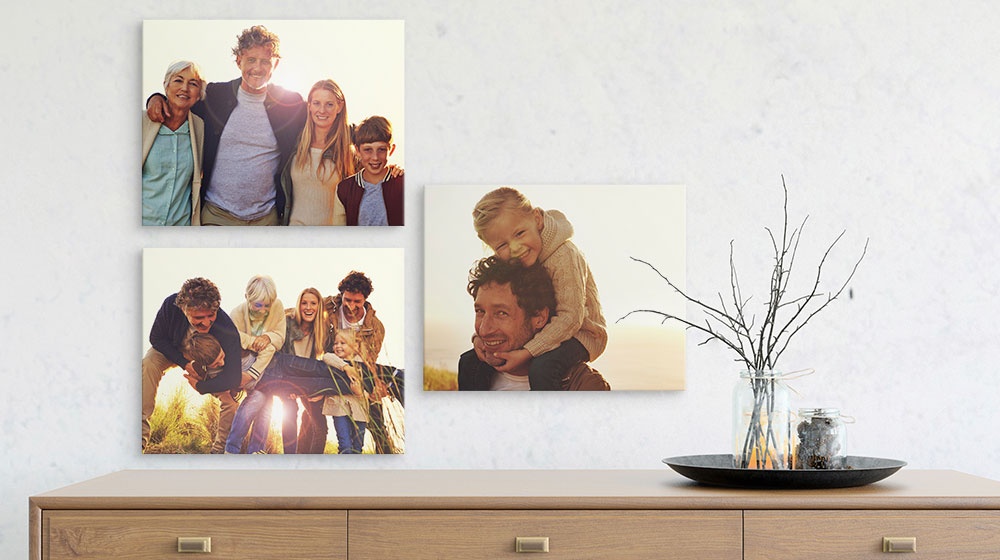 family photos printed on 11x14 canvas prints displayed over a buffet