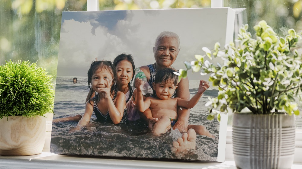 a desktop canvas print on a window sill