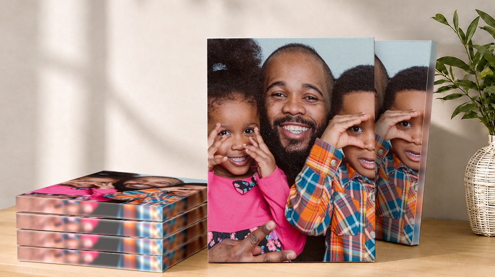 Family photo canvas prints featuring a father and two children making playful faces