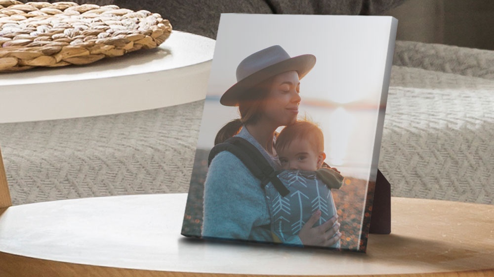 a desktop canvas print on a side table