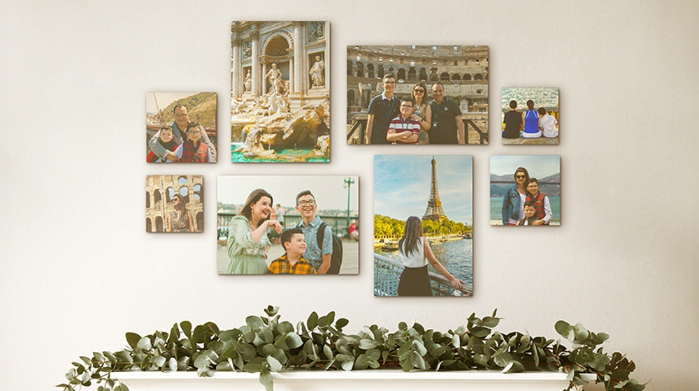 photo gallery wall of a family printed on canvas and hung above a mantle