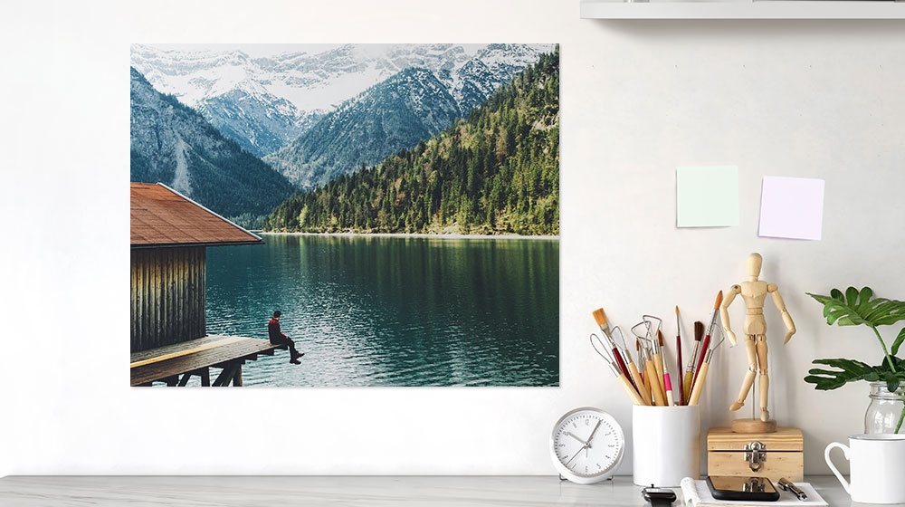 lake landscape printed on a poster and hanging at a desk