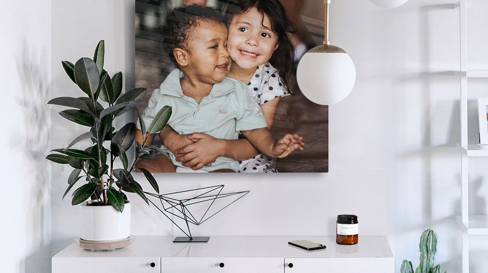 acrylic photo print of two kids in a minimalist modern room