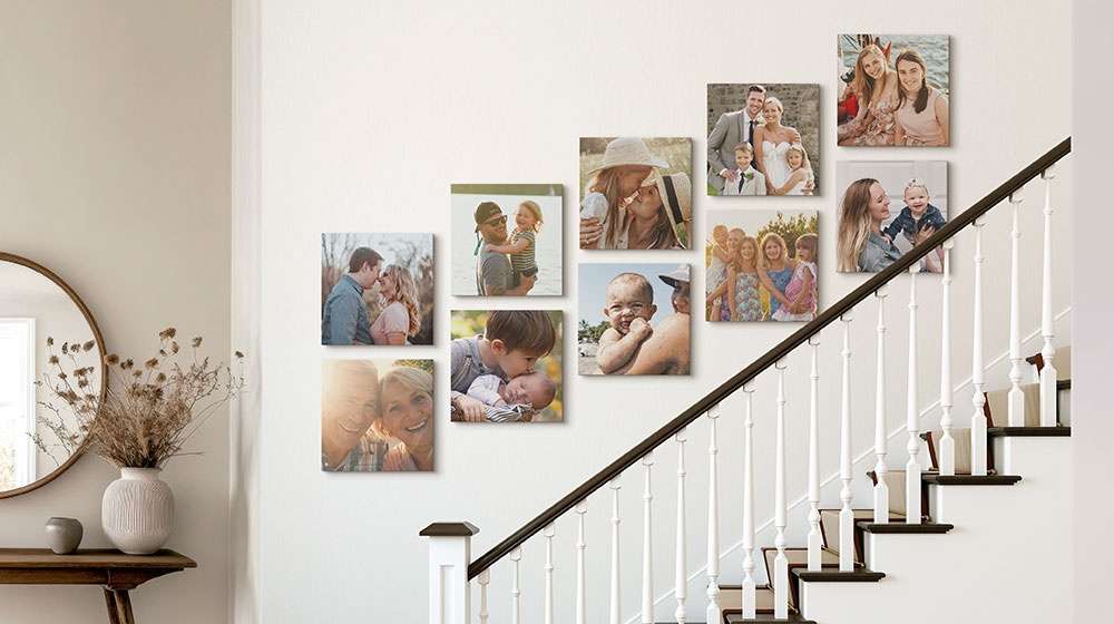 canvas gallery wall display featuring photos of a family in a stairway
