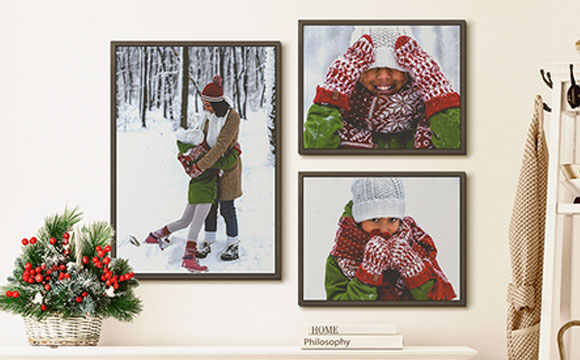 Dark wood floating framed canvases picturing a dad and his son.