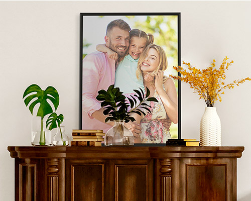 spring family photo in a black floating frame
