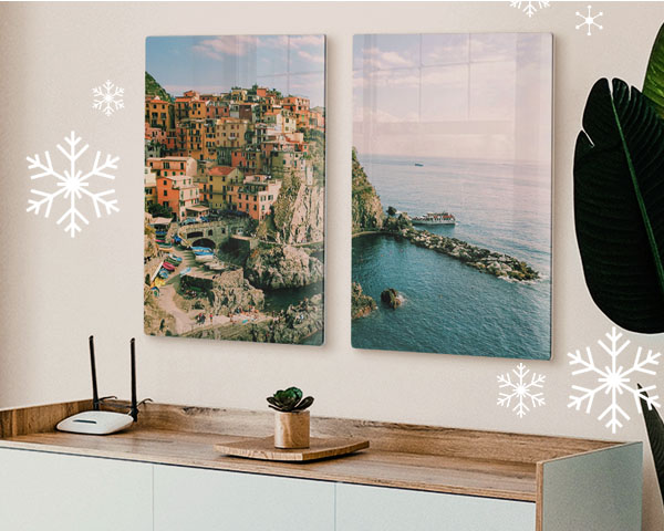 Two pictures of a travel experience printed on acrylic and hung over a sideboard