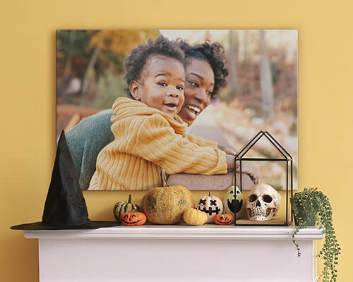large canvas of a mother and child over a mantel