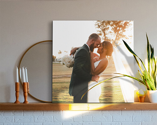 photo of a bride and groom at their wedding over a mantel