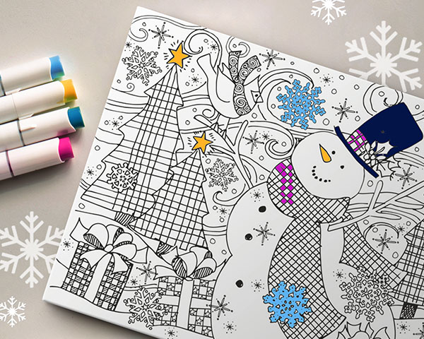 A coloring canvas print with the markers being used to color it.