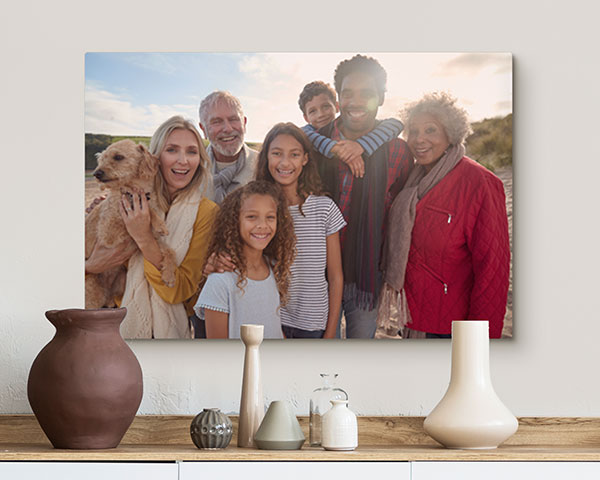 A Canvas Print of a family over an entryway table