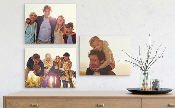 Three canvases with a variety of family photos