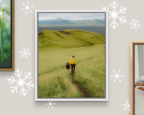 canvas print framed in white floating frame on a wall